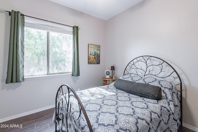 bedroom featuring dark hardwood / wood-style floors