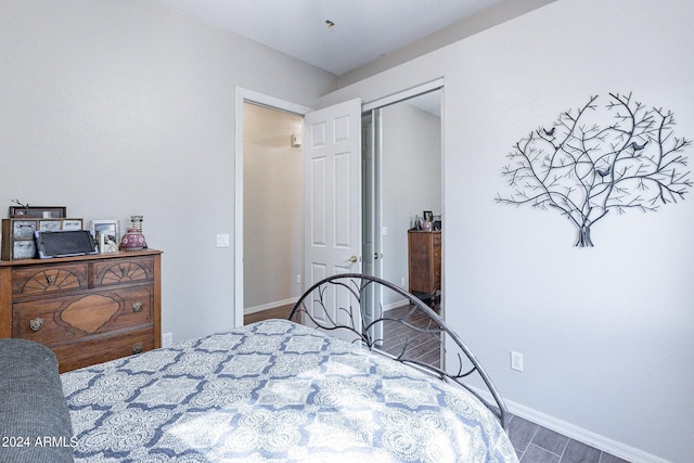 bedroom with hardwood / wood-style flooring and a closet