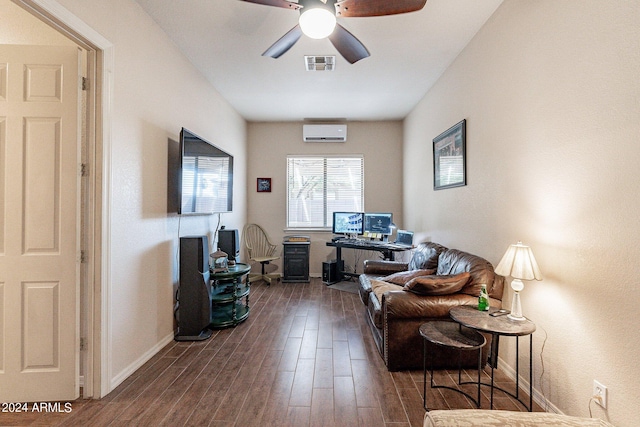 living room featuring dark hardwood / wood-style flooring, ceiling fan, and a wall unit AC