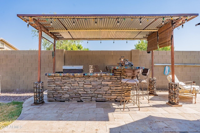 view of patio / terrace featuring exterior bar