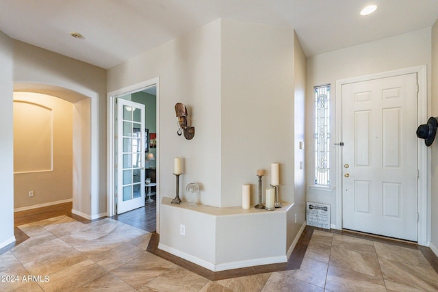 entryway with hardwood / wood-style flooring