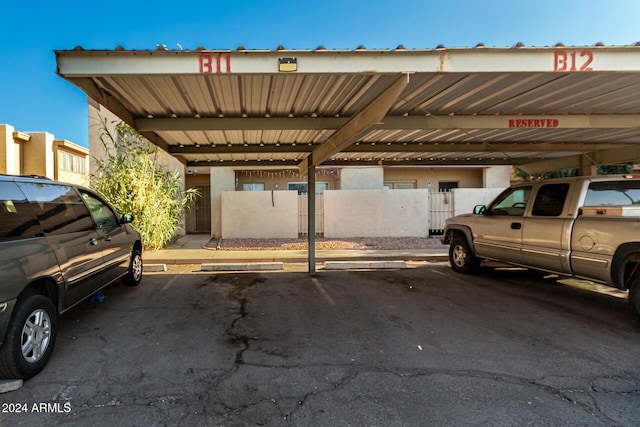 view of parking / parking lot featuring a carport