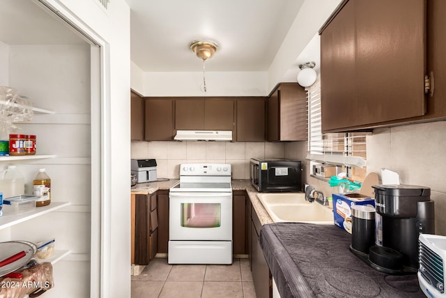 kitchen with dark brown cabinetry, sink, white electric range oven, tasteful backsplash, and light tile patterned floors