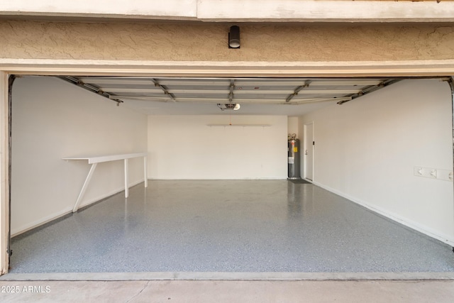 garage with water heater and a garage door opener