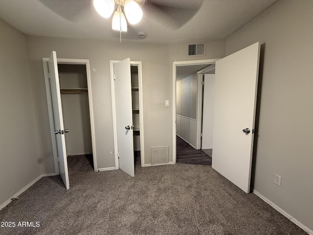 unfurnished bedroom with carpet, a closet, and visible vents