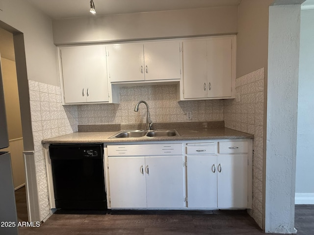 kitchen with a sink, black dishwasher, white cabinetry, tasteful backsplash, and dark wood-style floors