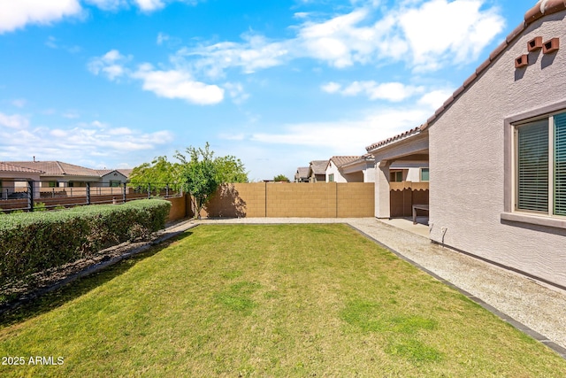 view of yard with a fenced backyard