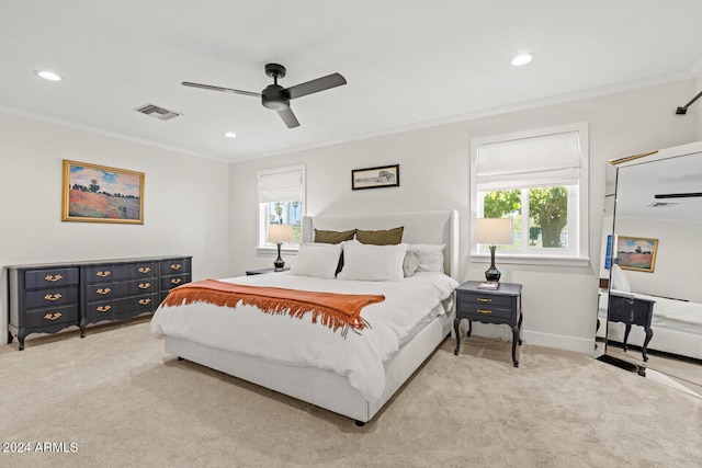 carpeted bedroom with multiple windows, crown molding, and ceiling fan