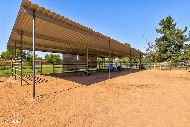 view of community featuring an outbuilding and a rural view