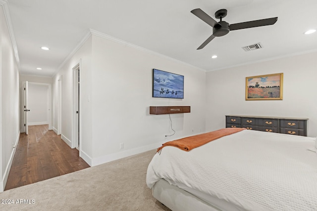 bedroom featuring crown molding, ceiling fan, and dark hardwood / wood-style flooring