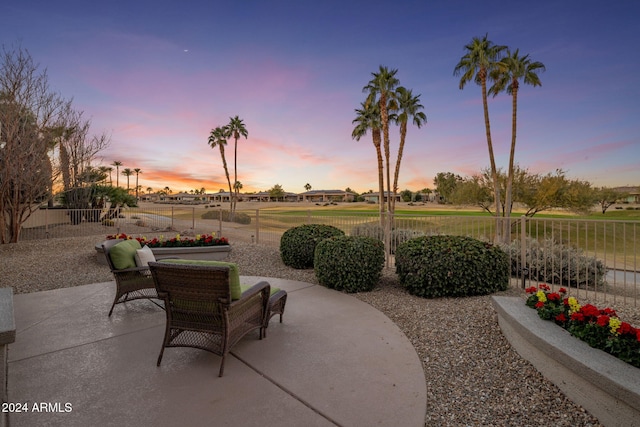 view of patio terrace at dusk