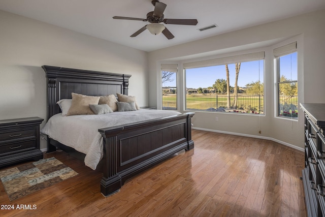 bedroom featuring wood-type flooring and ceiling fan