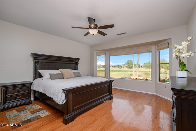 bedroom featuring ceiling fan and light hardwood / wood-style flooring