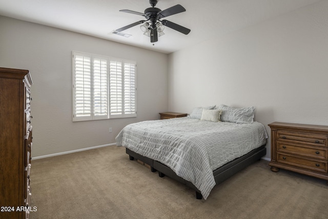 bedroom featuring ceiling fan and light carpet