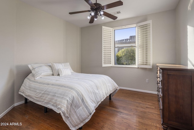 bedroom featuring ceiling fan and dark hardwood / wood-style floors