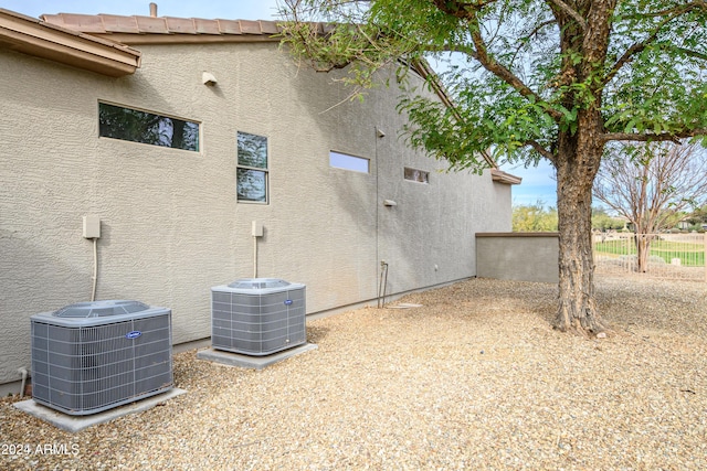 view of property exterior with central AC unit