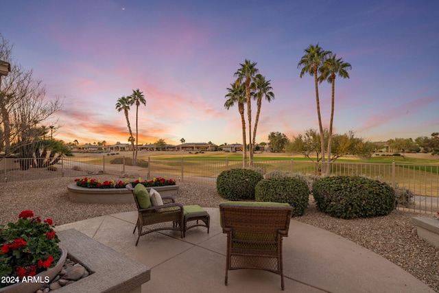 view of patio terrace at dusk