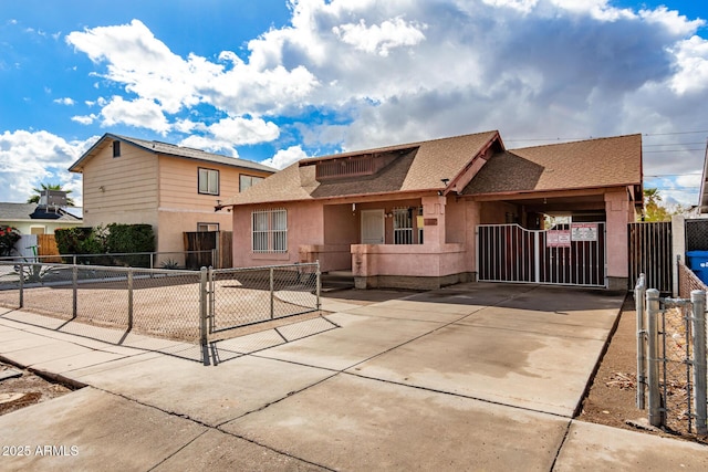 view of front facade with a fenced front yard, roof with shingles, and a gate