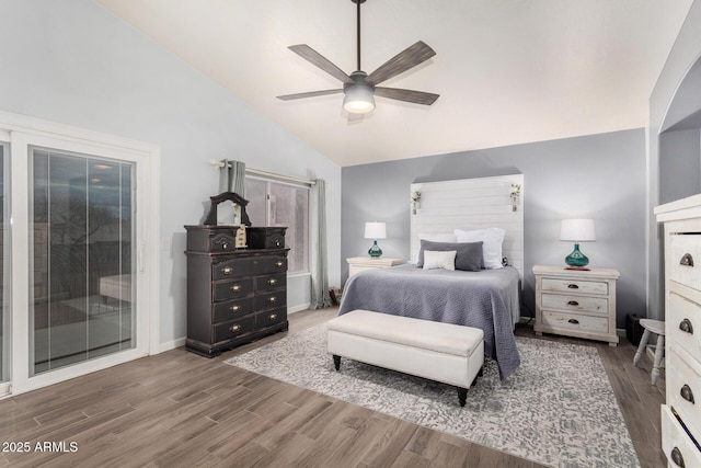 bedroom featuring a ceiling fan, access to exterior, wood finished floors, and vaulted ceiling