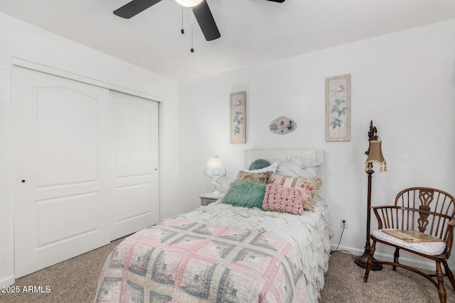 carpeted bedroom featuring a closet and a ceiling fan