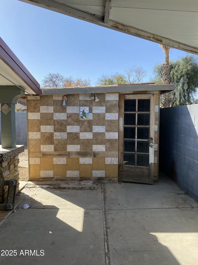 exterior space featuring a patio area and fence