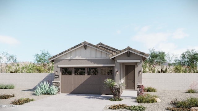 view of front of property featuring stucco siding, concrete driveway, an attached garage, and fence