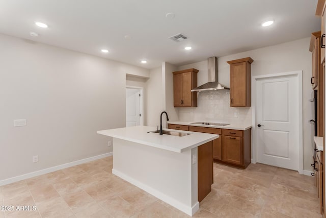 5678 N 205th Ln, Buckeye, AZ 85396 - kitchen featuring wall chimney exhaust hood, a sink, black electric stovetop, brown cabinetry, and recessed lighting
