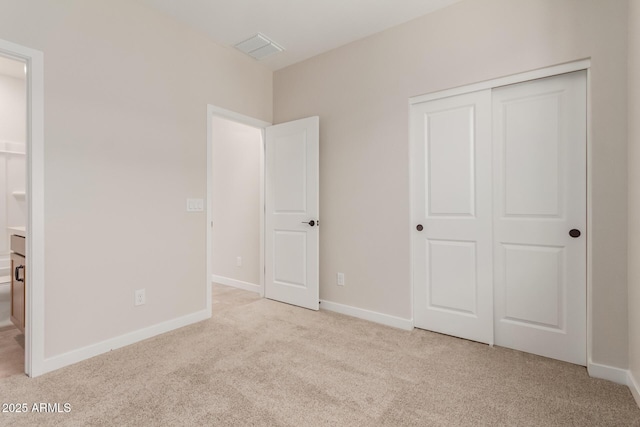 5678 N 205th Ln, Buckeye, AZ 85396 - unfurnished bedroom featuring carpet, a closet, and baseboards
