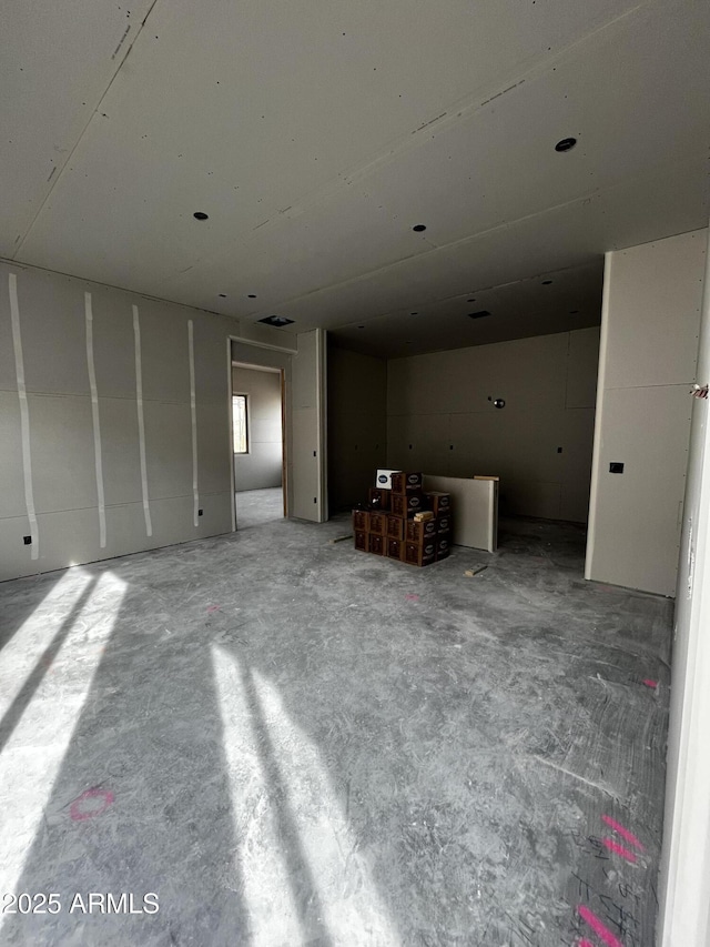 interior space featuring concrete flooring