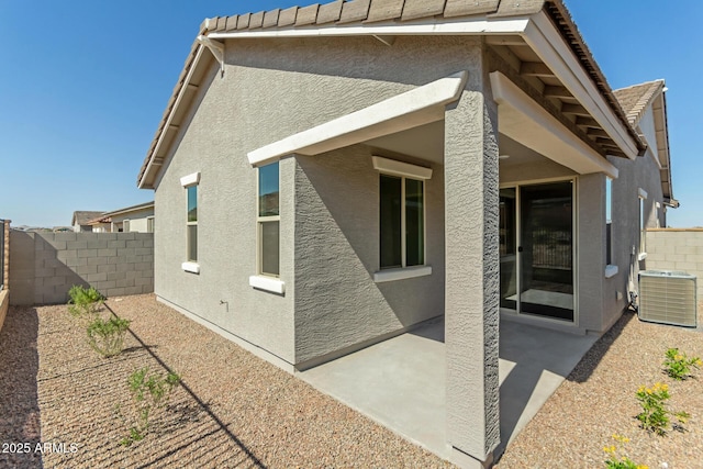 5678 N 205th Ln, Buckeye, AZ 85396 - back of house featuring stucco siding, a patio area, and central AC