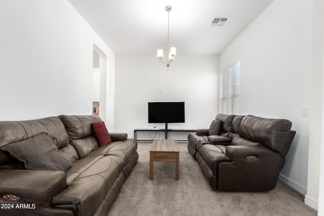 living room featuring an inviting chandelier and carpet