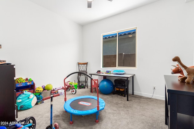 game room with light colored carpet and ceiling fan