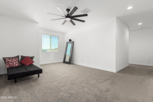 sitting room featuring ceiling fan and carpet floors