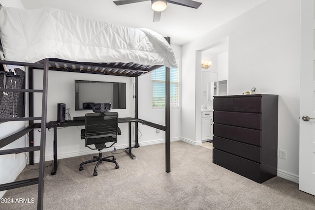 carpeted bedroom featuring ensuite bathroom and ceiling fan