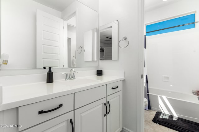 full bathroom with toilet, vanity, shower / bath combination with curtain, and tile patterned flooring