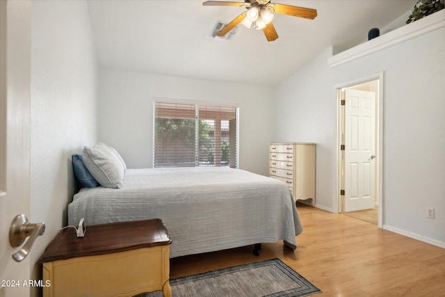 bedroom with light wood-type flooring, ceiling fan, and lofted ceiling