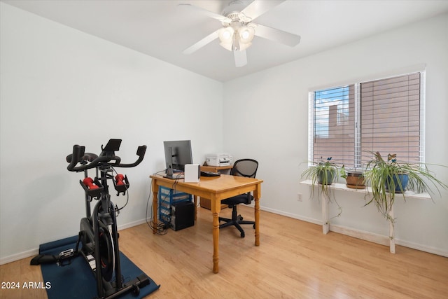 office area with light wood-type flooring and ceiling fan