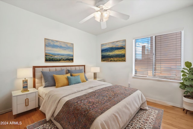 bedroom featuring light wood-type flooring and ceiling fan