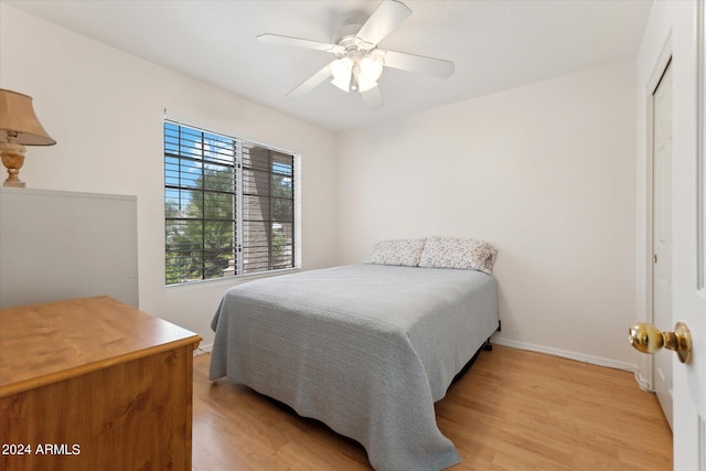 bedroom featuring light hardwood / wood-style floors and ceiling fan