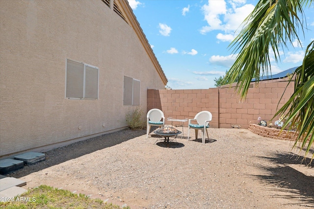 view of patio featuring a fire pit