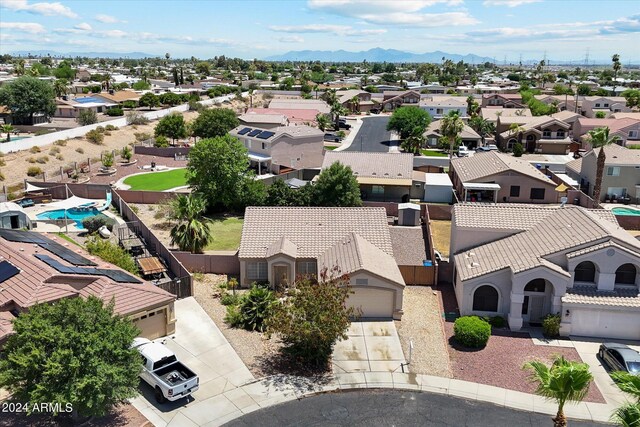 birds eye view of property with a mountain view