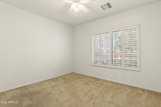 empty room with carpet flooring and ceiling fan