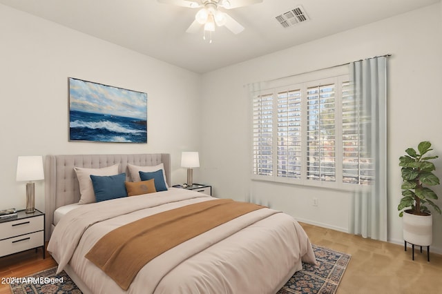 carpeted bedroom with ceiling fan