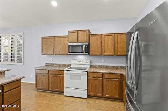 kitchen featuring appliances with stainless steel finishes and light wood-type flooring