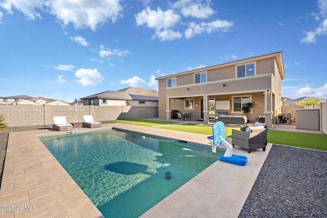 view of pool featuring outdoor lounge area, a fenced backyard, a fenced in pool, and a patio area