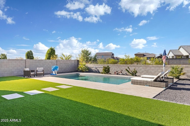 view of pool featuring a lawn, a fenced in pool, a fenced backyard, and a patio area