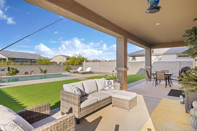 view of patio / terrace with outdoor lounge area, a fenced backyard, outdoor dining area, and a fenced in pool
