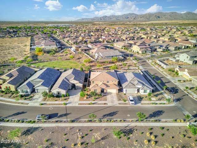 drone / aerial view featuring a residential view and a mountain view