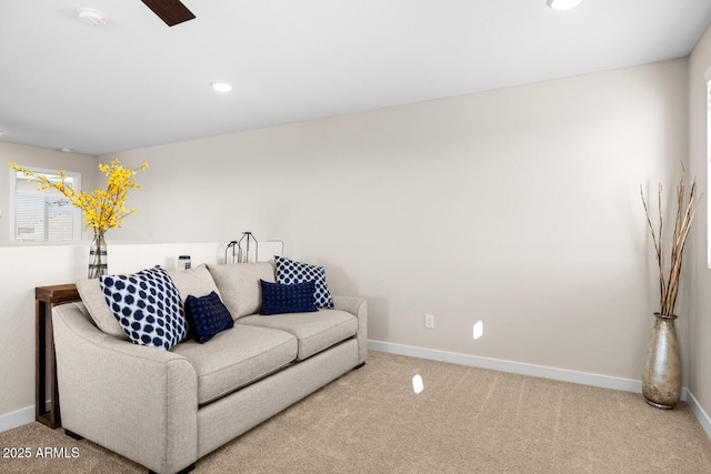living area with carpet floors and baseboards