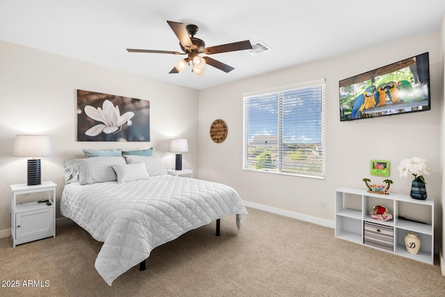 carpeted bedroom featuring a ceiling fan, visible vents, and baseboards